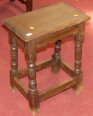 Lot 553 - A 17th century style oak coffin stool, width 47cm