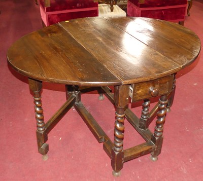 Lot 554 - A circa 1700 joined oak and fruitwood gateleg...