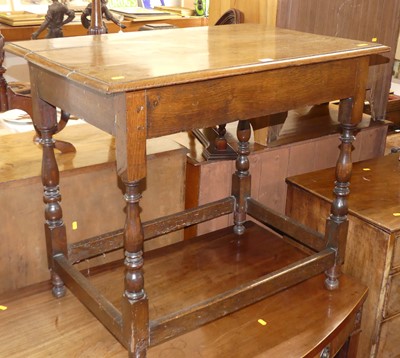 Lot 562 - An antique joined oak side table having a...