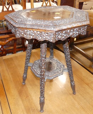 Lot 578 - A circa 1900 Burmese carved hardwood two-tier...