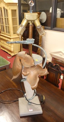 Lot 587 - A reproduction bronzed metal and glass table...