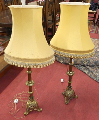 Lot 590 - A pair of baroque style brass table lamps,...