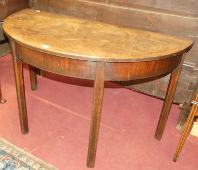 Lot 597 - A George III mahogany demi lune side table on...