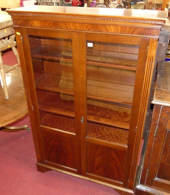 Lot 604 - A reproduction mahogany glazed double door...