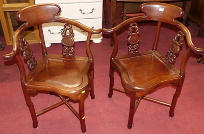 Lot 612 - A pair of Chinese hardwood horseshoe back...