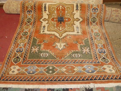 Lot 700 - A Persian woollen kazak peachground rug 200 x...