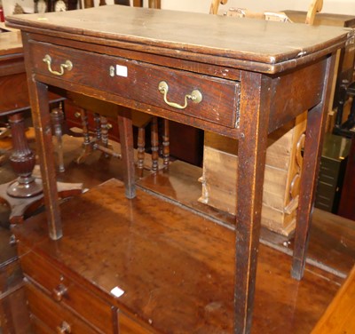 Lot 644 - A George III oak tea table, with fold over top...