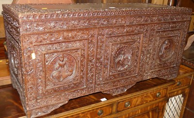 Lot 639 - A Burmese well carved hardwood blanket chest...