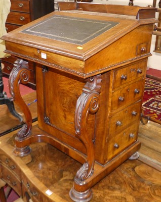 Lot 642 - A Victorian walnut kneehole writing Davenport...
