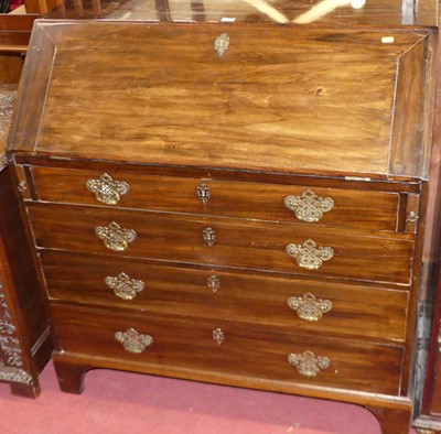 Lot 655 - A George III mahogany slope front writing...