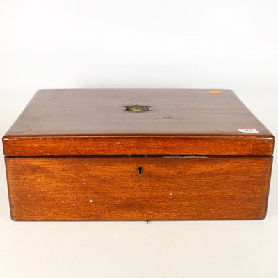 Lot 212 - An early 20th century oak canteen, containing...