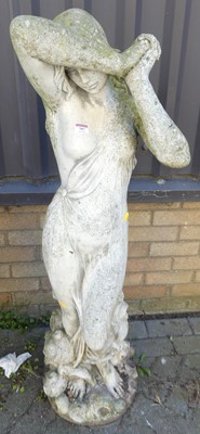 Lot 707 - A reconstituted stone garden figure of a...