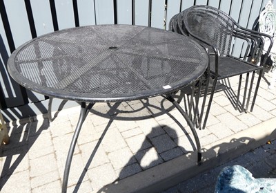 Lot 714 - A modern black painted metal circular patio...