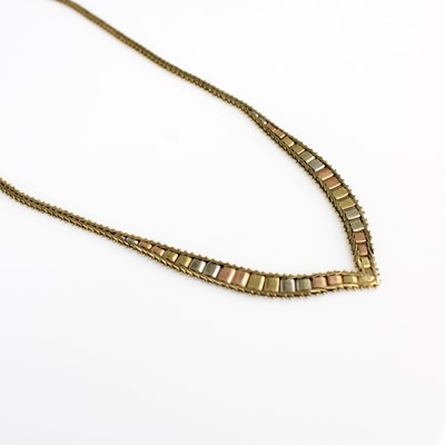Lot 393 - A modern 9ct three coloured gold wishbone...
