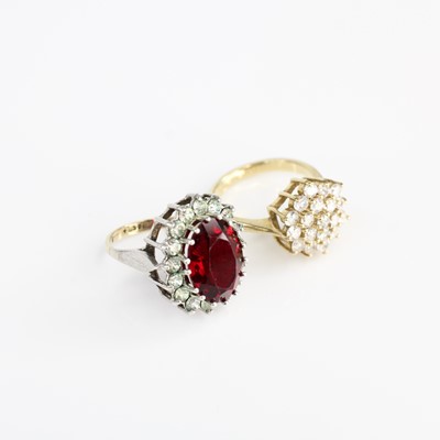 Lot 385 - A modern yellow metal CZ set flower head...