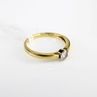 Lot 333 - An 18ct gold diamond solitaire ring, the claw...