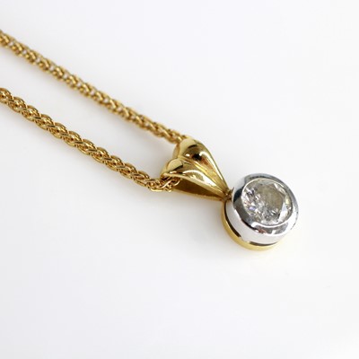 Lot 2136 - An 18ct yellow and white gold diamond single...