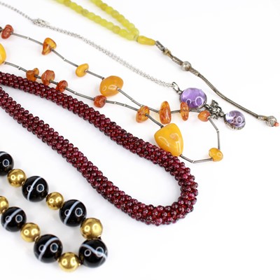 Lot 2143 - A selection of necklaces, to include a long...