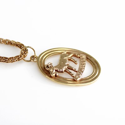 Lot 2165 - A 9ct yellow gold oval Capricorn openwork...
