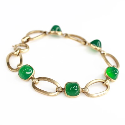 Lot 2168 - A yellow metal chrysoprase bracelet, featuring...