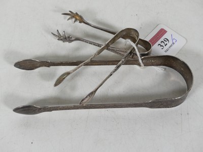 Lot 329 - A pair of George III silver sugar tongs...