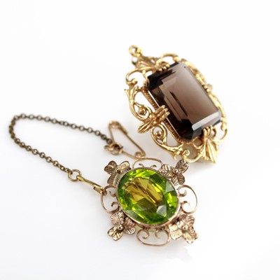 Lot 2076 - A 9ct yellow gold openwork smokey quartz...