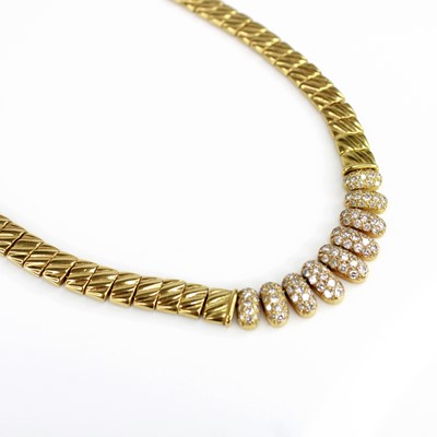 Lot 142 - A yellow metal diamond articulated necklace,...