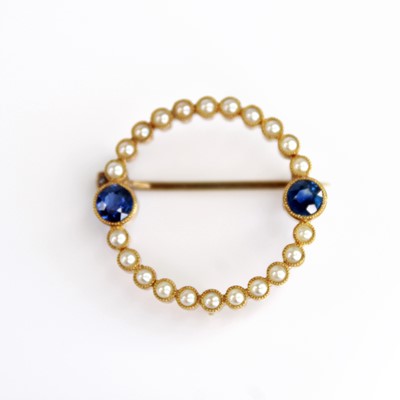 Lot 2081 - A yellow metal sapphire and pearl circular...