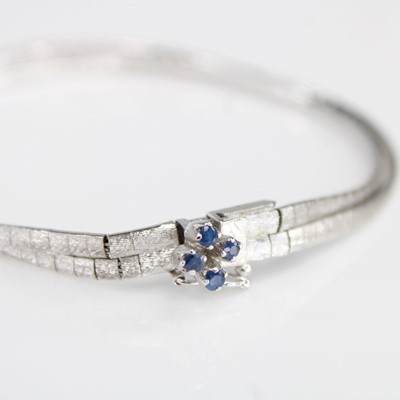 Lot 2118 - A modern continental white metal and sapphire...