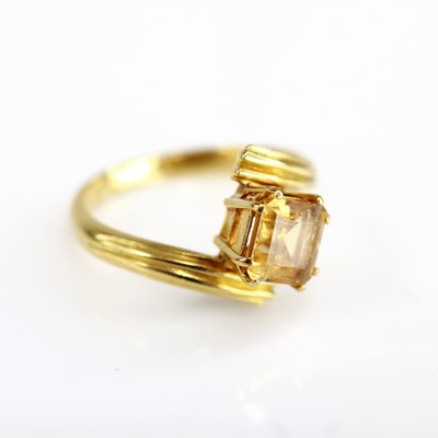 Lot 2074 - A yellow metal citrine crossover style ring...