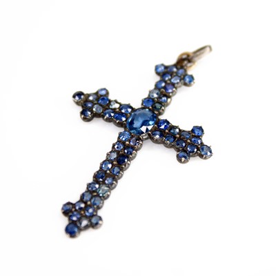 Lot 2172 - A white metal sapphire cross pendant...