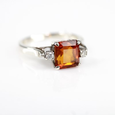 Lot 2180 - A white metal citrine and diamond dress ring...
