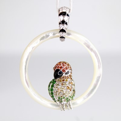 Lot 2218 - A gem set mother of pearl and diamond pendant,...