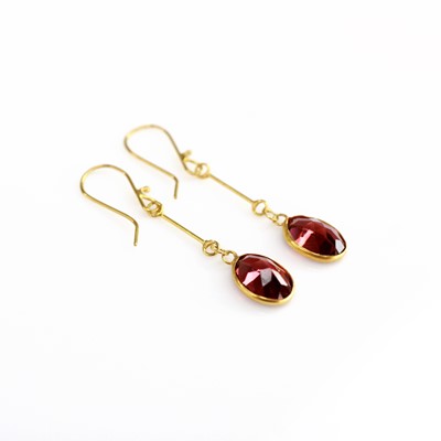 Lot 2185 - A pair of contemporary yellow metal garnet set...