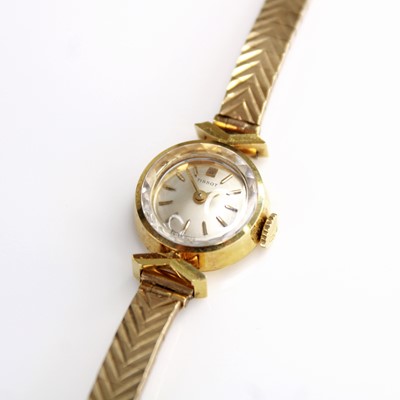 Lot 2208 - A Tissot lady's 9ct gold bracelet watch,...