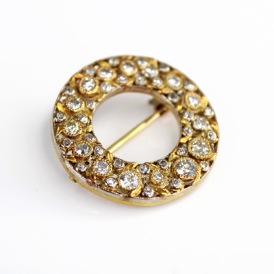 Lot 2205 - An 18ct gold and platinum faced circular...