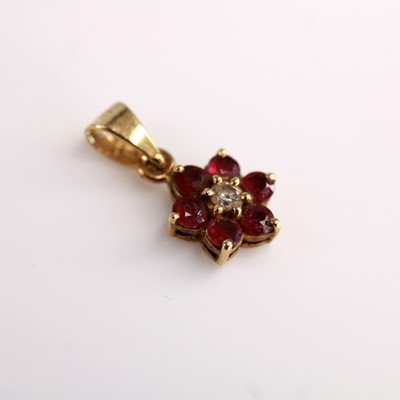 Lot 2107 - A Far Eastern 14ct gold ruby and zircon flower...