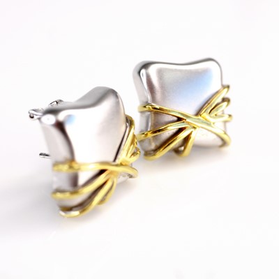 Lot 2223 - A pair of contemporary 18ct white gold ear...