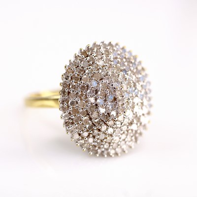 Lot 2188 - An 18ct gold diamond cluster ring, arranged as...