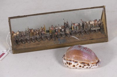 Lot 246 - Folk Art; 19th century cowrie shell cameo,...