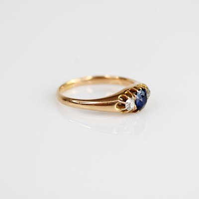 Lot 2237 - A yellow metal, sapphire and diamond...