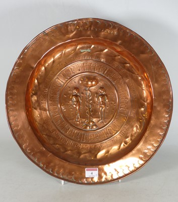 Lot 4 - A copper alms dish, central ground decorated...
