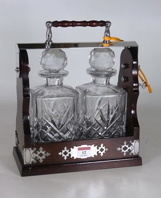 Lot 12 - A reproduction mahogany and silver plated...