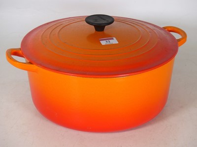 Lot 32 - A Le Creuset enamelled iron casserole dish and...