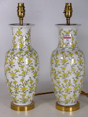Lot 38 - A pair of porcelain and brass mounted table...