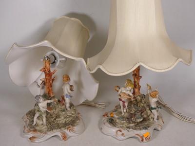 Lot 57 - A pair of Capo di Monte style table lamps,...