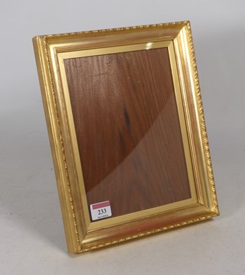 Lot 233 - A gilt wood easel photograph frame with...