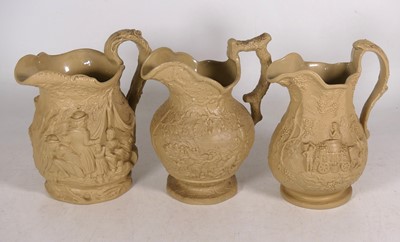 Lot 104 - A collection of Victorian relief moulded jugs,...