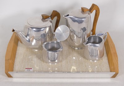 Lot 136 - A Picquot ware five-piece brushed aluminium...