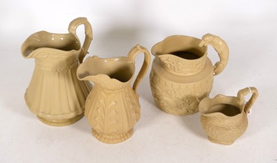 Lot 145 - A collection of Victorian relief moulded jugs...